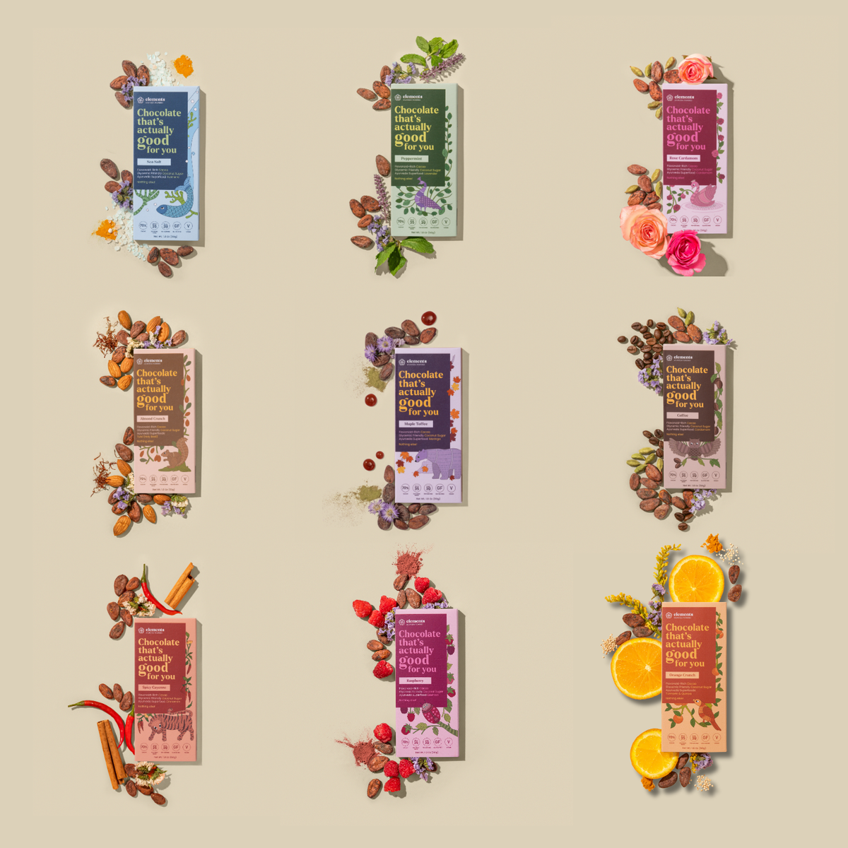 Nine chocolate bar packages arranged in a 3x3 grid on a warm beige background, each styled with decorative ingredients such as flowers, cinnamon sticks, citrus slices, and nuts. The packages feature different flavor/colorways including blue, green, pink, and brown tones, with readable text including 'Chocolate with.