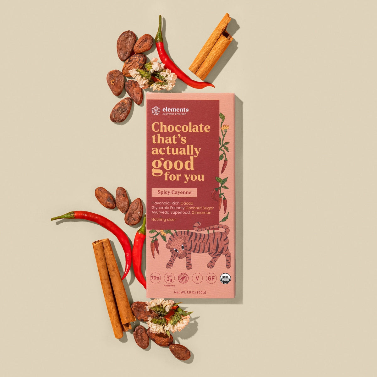 Spicy Cayenne & Cinnamon dark chocolate bar with chili peppers and cinnamon sticks by Elements Truffles