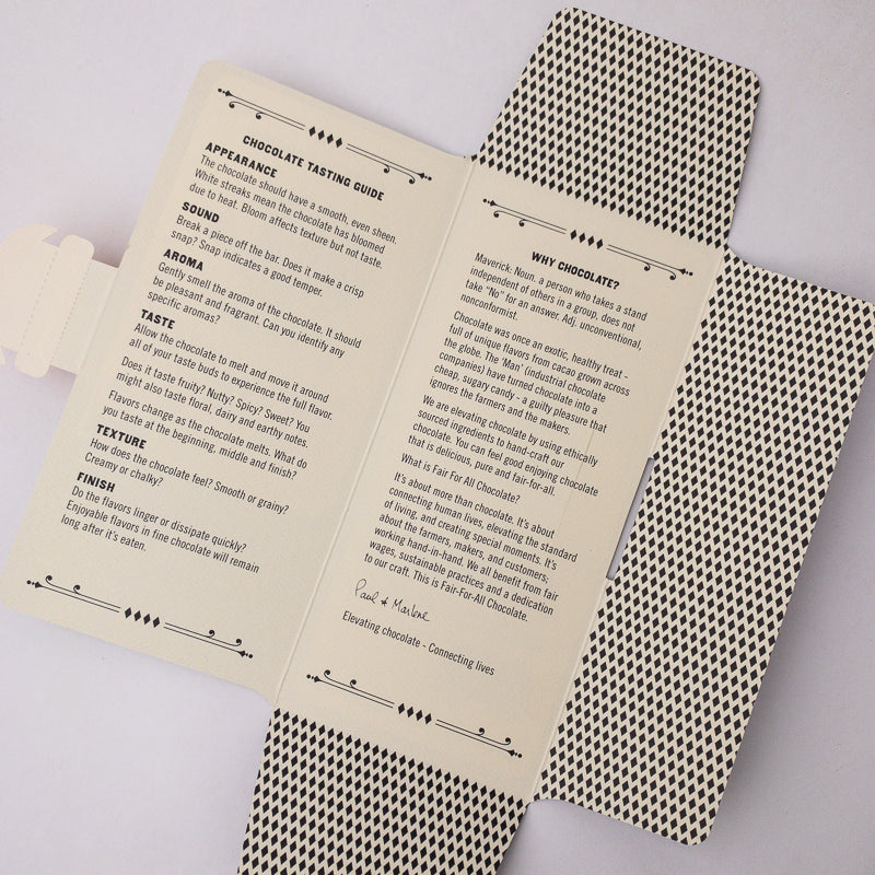 Open book with chocolate tasting guide on a gray background