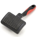 A black pet grooming brush with a red and black handle, shown on a clean white background.